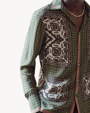 Load image into Gallery viewer, Traditional patterned shirt on a mannequin against a white background
