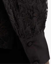 Load image into Gallery viewer, Black lace top and black coat with buttons on a white background
