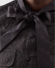 Load image into Gallery viewer, Dark lace blouse with a bow detail on a blurred background
